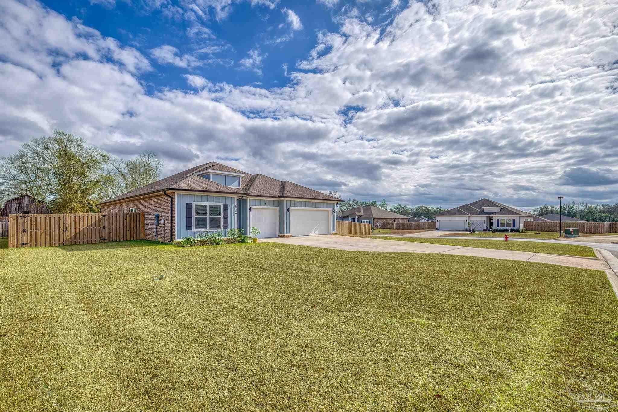 6266 Dry Creek Road Molino, FL 32577 - Photo 66 of 68 a view of a house with a yard