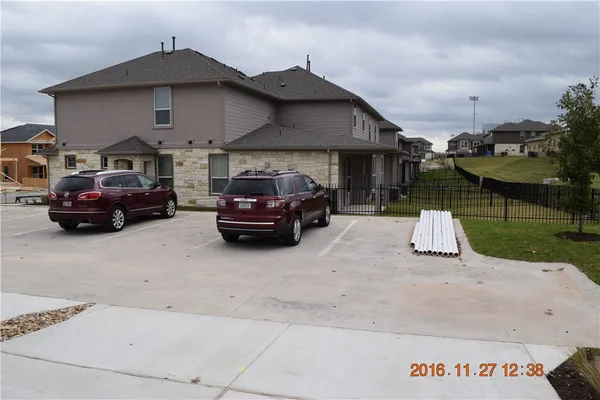 a car parked in front of a house