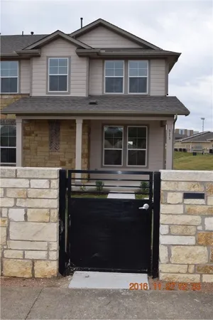 a front view of a house with a parking area