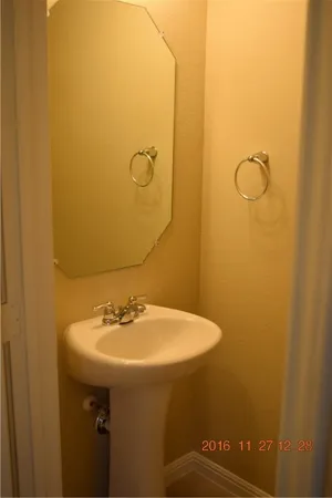 a bathroom with a sink and mirror