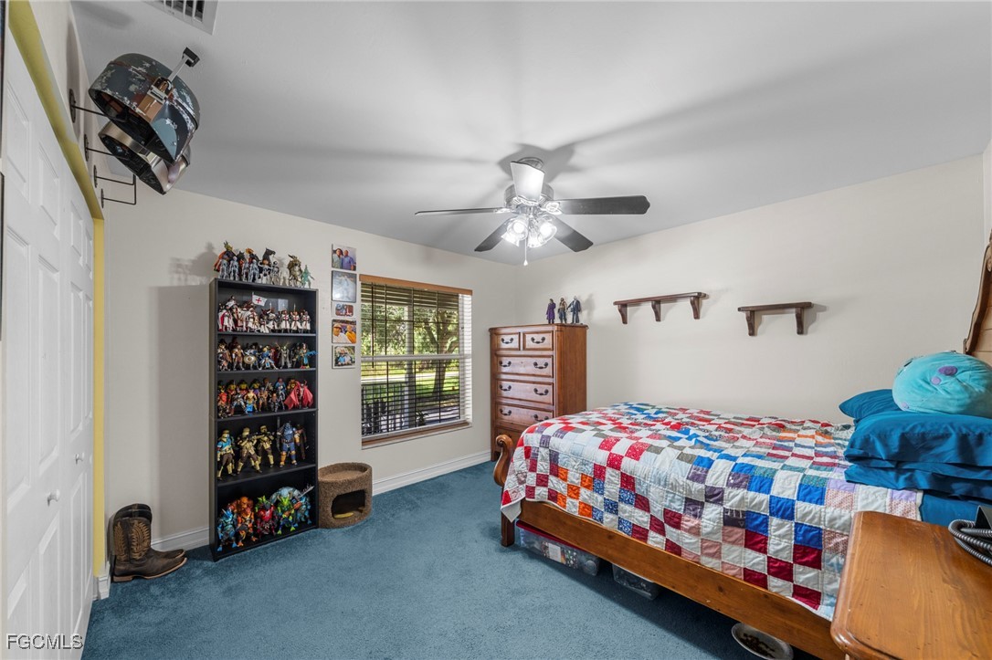 90 24th Avenue Northeast Naples, FL 34120 - Photo 17 of 50 a bedroom with bed and a window