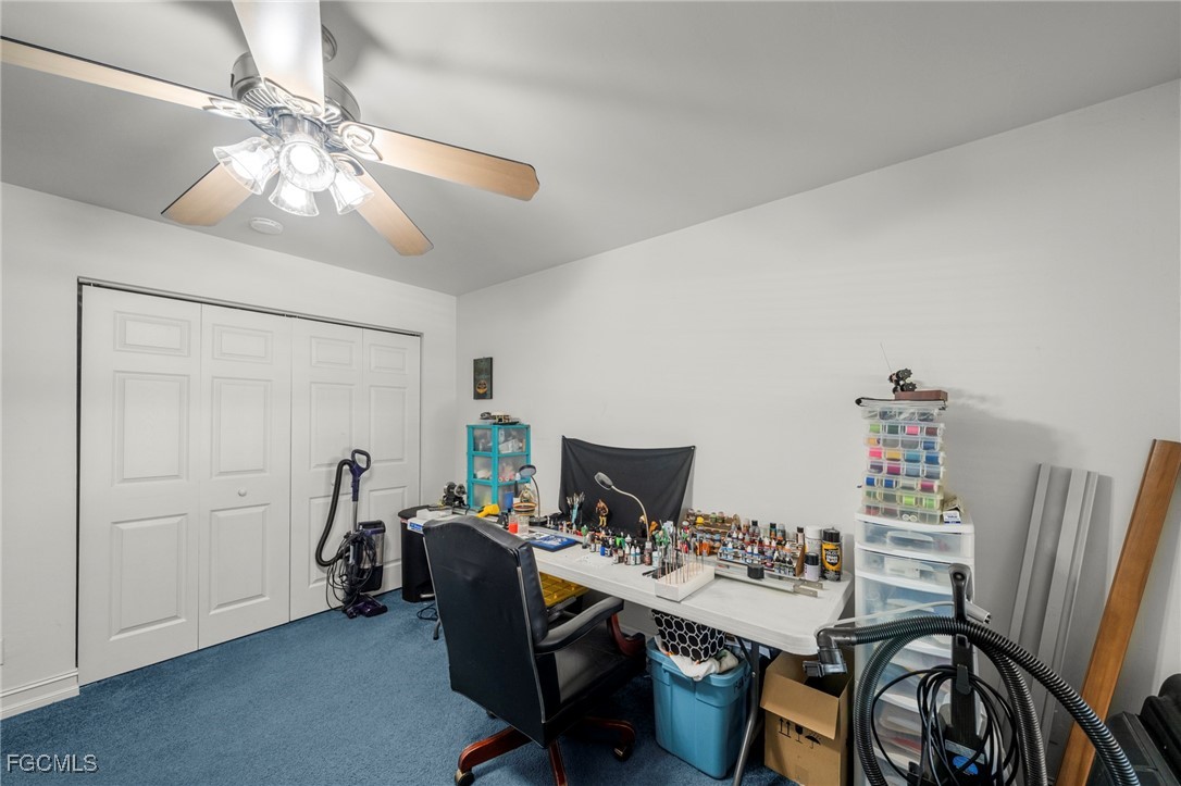 90 24th Avenue Northeast Naples, FL 34120 - Photo 22 of 50 a view of a workspace with furniture and a chandelier
