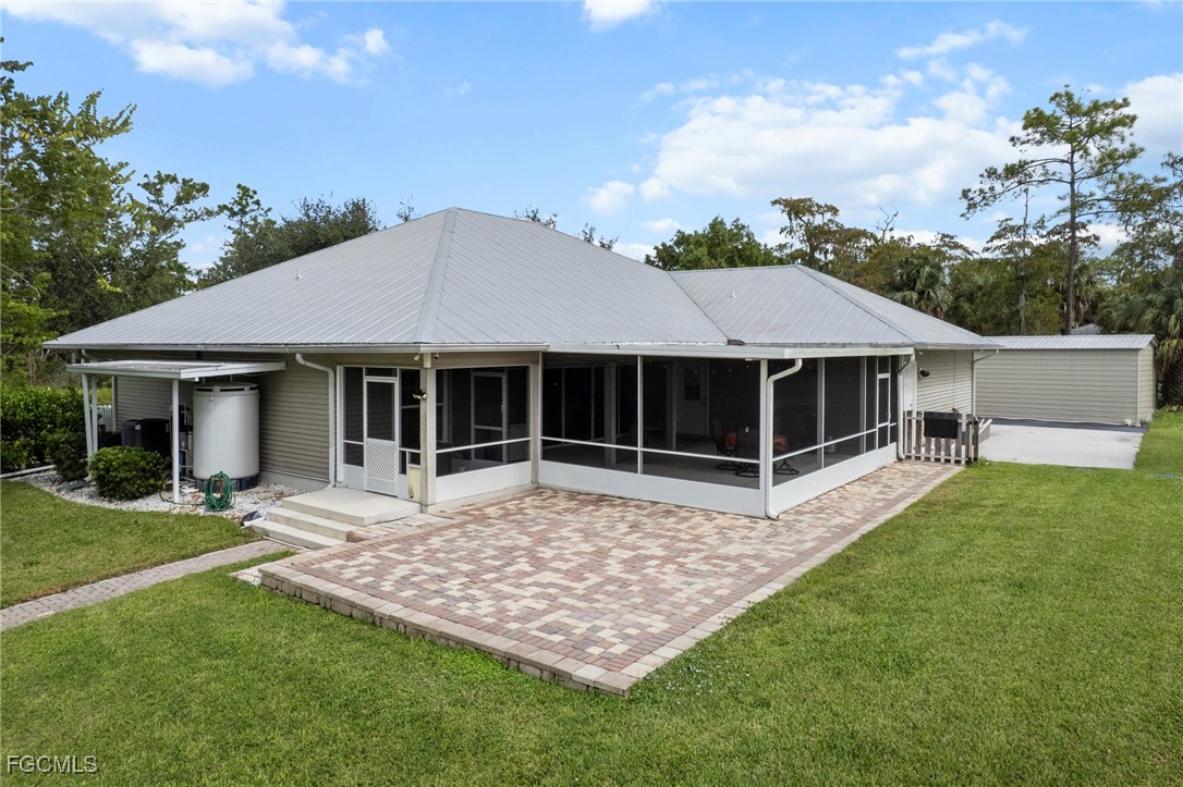 90 24th Avenue Northeast Naples, FL 34120 - Photo 24 of 44 a house with garden in front of it