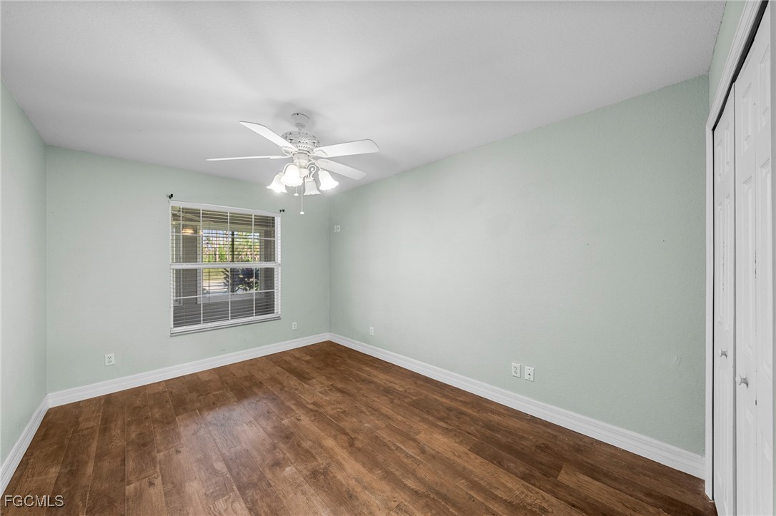 90 24th Avenue Northeast Naples, FL 34120 - Photo 34 of 50 wooden floor in an empty room with a window