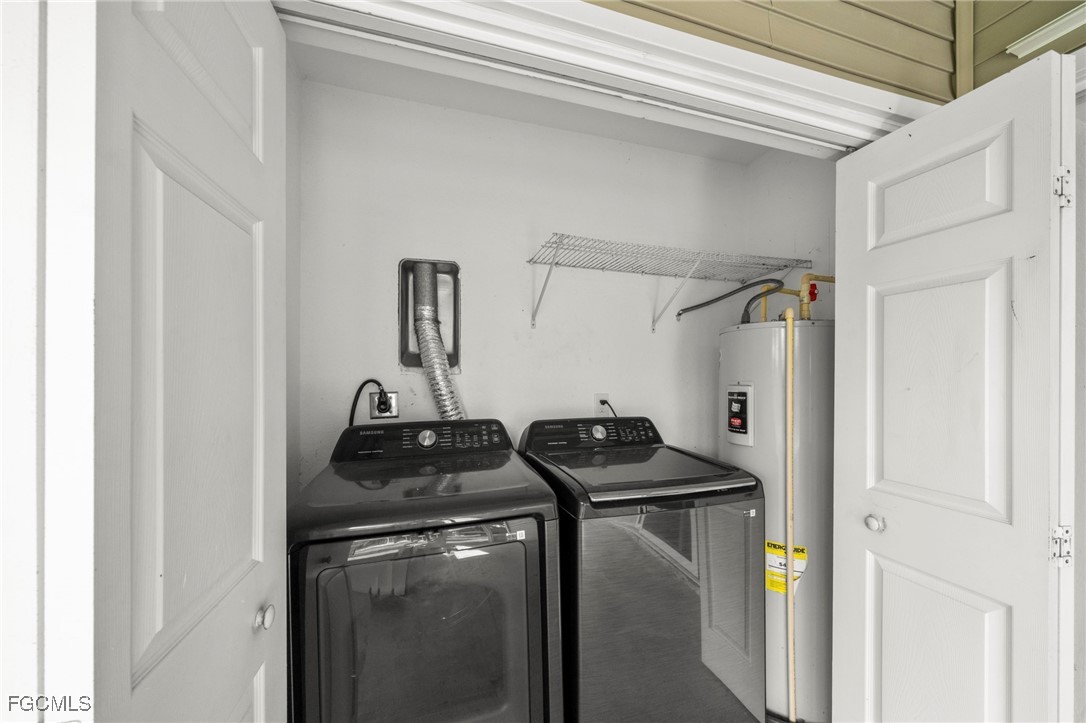 90 24th Avenue Northeast Naples, FL 34120 - Photo 38 of 50 a utility room with dryer and washer