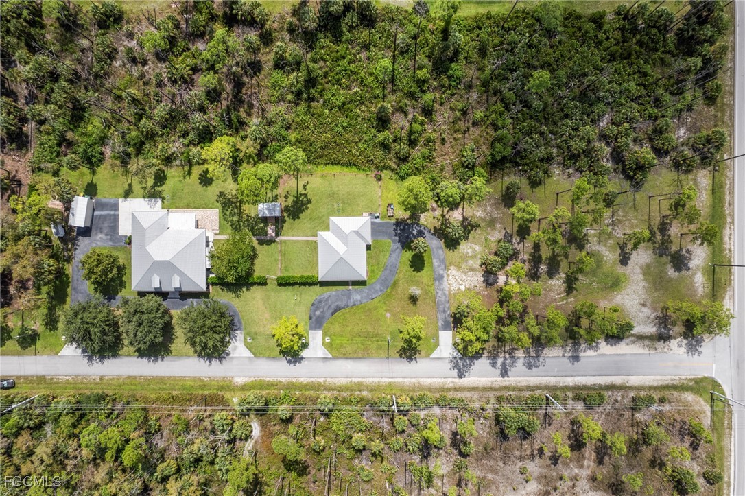 90 24th Avenue Northeast Naples, FL 34120 - Photo 49 of 50 an aerial view of a house with a yard