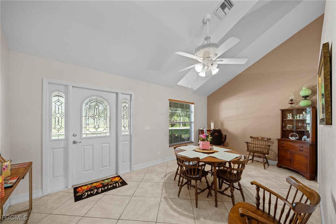 90 24th Avenue Northeast Naples, FL 34120 - Photo 9 of 44 a workspace with furniture and window