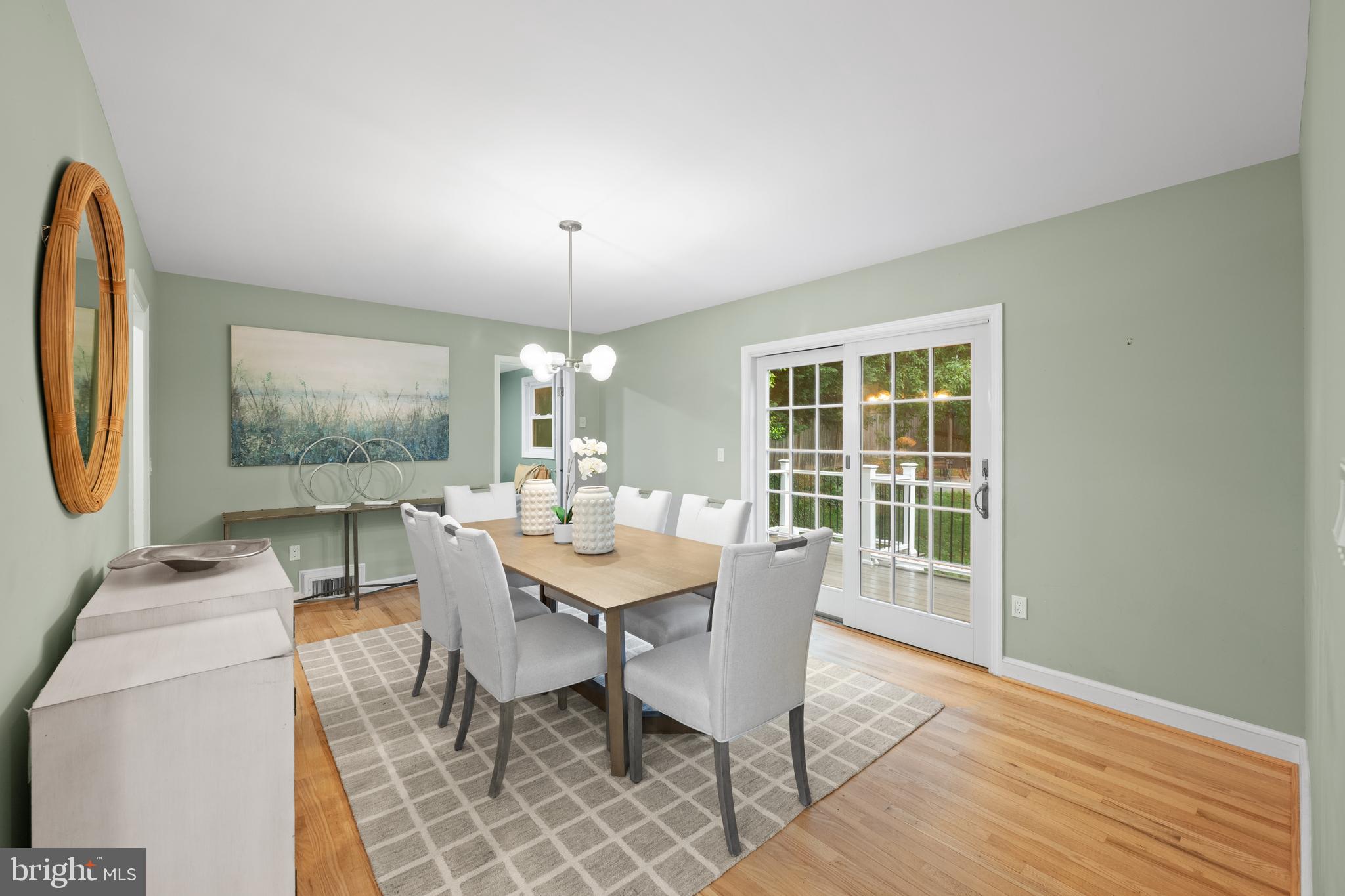 403 East Melbourne Avenue Silver Spring, MD 20901 - Photo 12 of 33 a dining room with furniture a rug and wooden floor