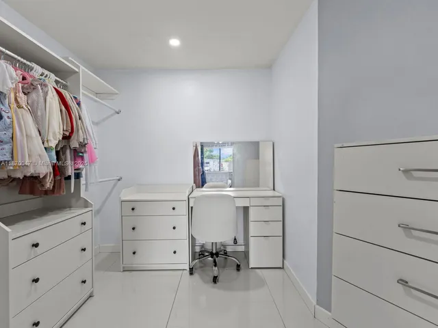 a view of a workspace with furniture