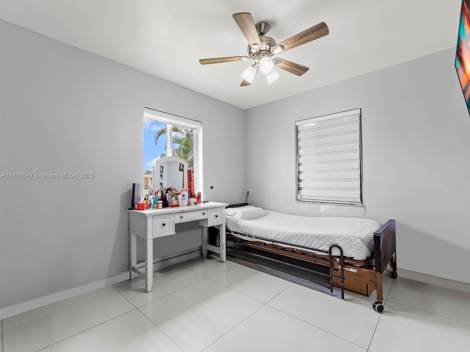 11350 Southwest 46th Street Miami, FL 33165 - Photo 13 of 20 a room with furniture and window
