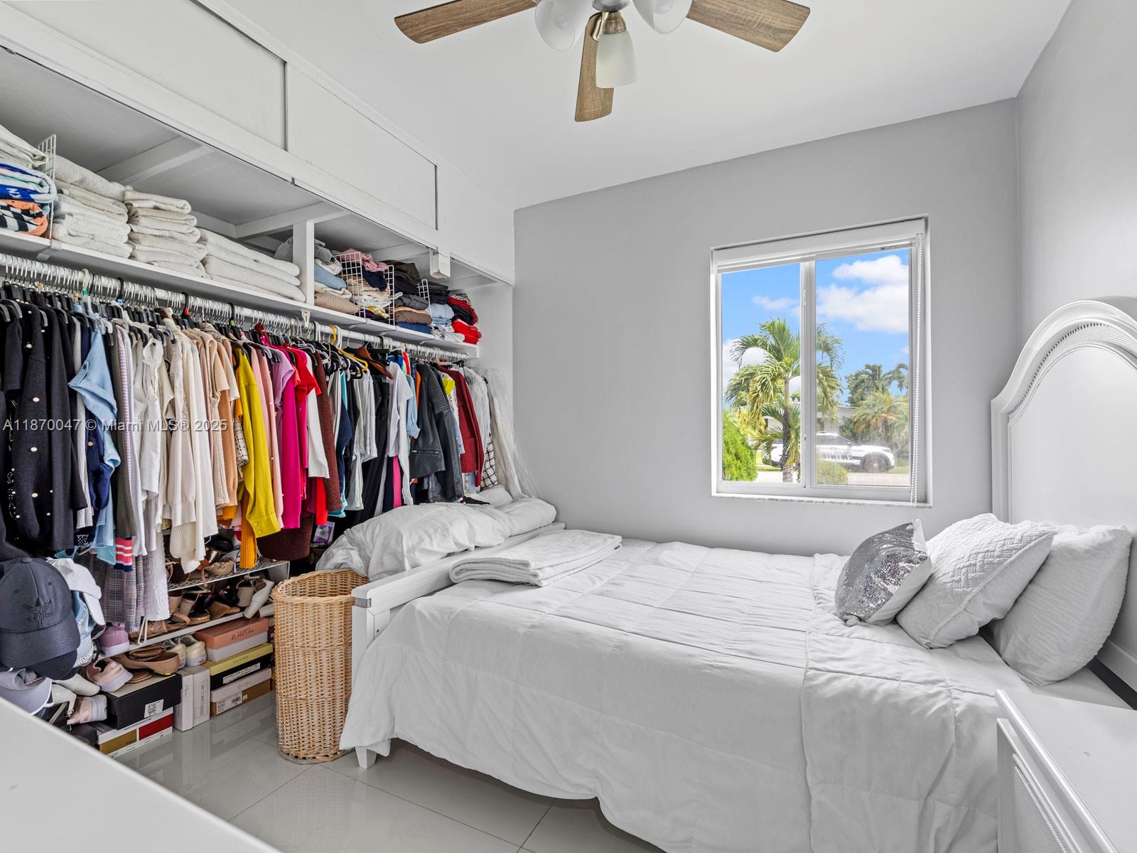 11350 Southwest 46th Street Miami, FL 33165 - Photo 14 of 20 a view of walk in closet with clothes and shoes