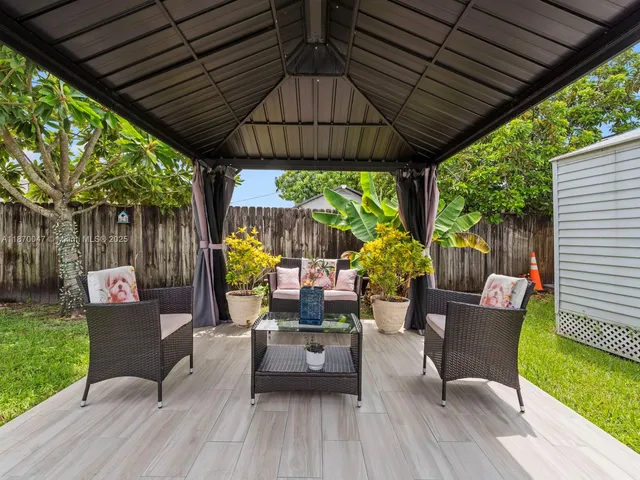 a outdoor living space with furniture and garden view
