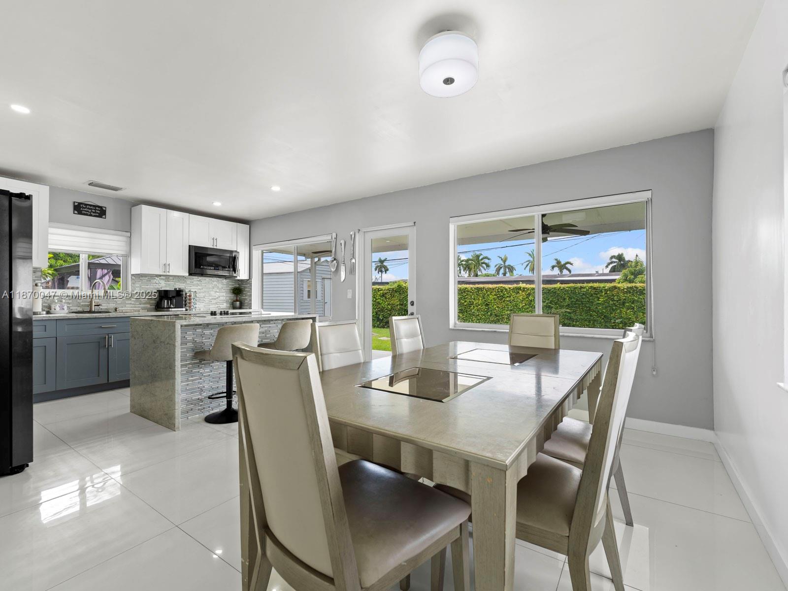 11350 Southwest 46th Street Miami, FL 33165 - Photo 7 of 20 a view of a dining room with furniture window and outside view