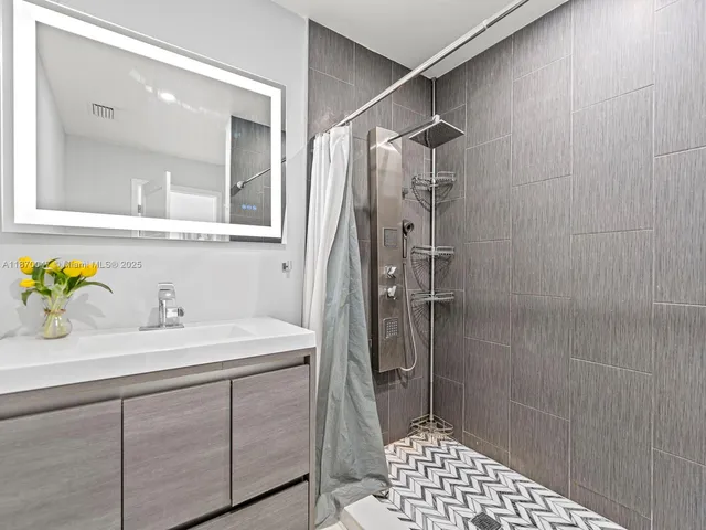 a bathroom with a sink and a mirror