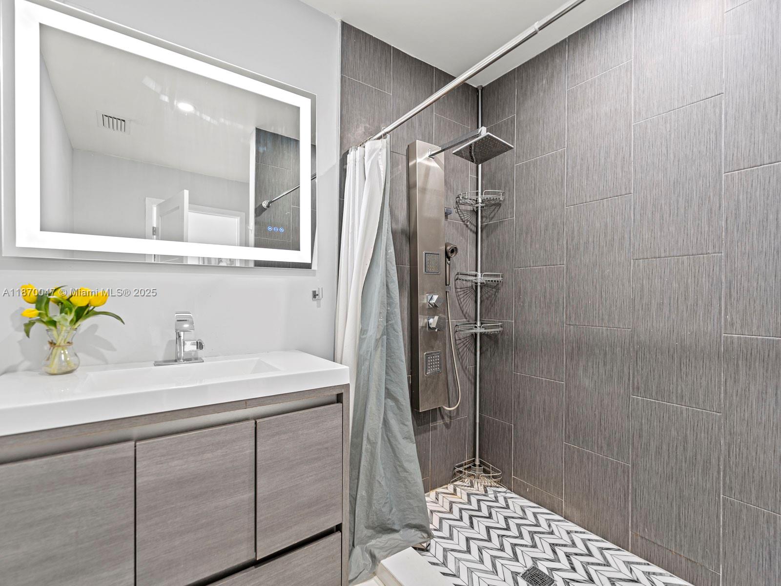 11350 Southwest 46th Street Miami, FL 33165 - Photo 8 of 20 a bathroom with a sink and a mirror