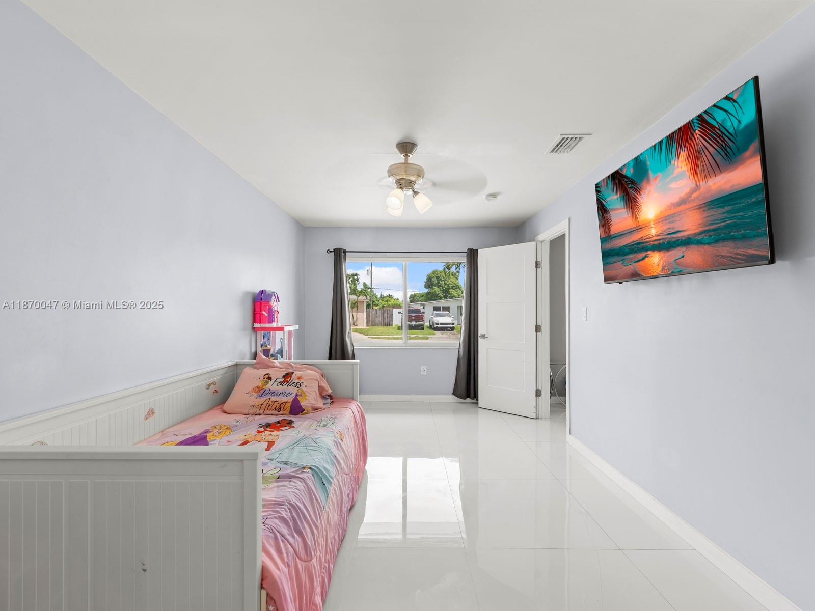 11350 Southwest 46th Street Miami, FL 33165 - Photo 10 of 20 a bedroom with furniture and a chandelier