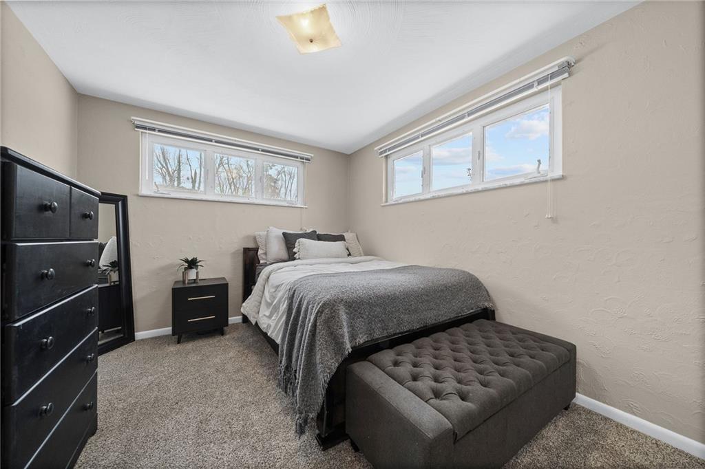 106 Windsor Drive Irwin, PA 15642 - Photo 19 of 30 Bright second bedroom with a well-proportioned layout and ample natural light.
