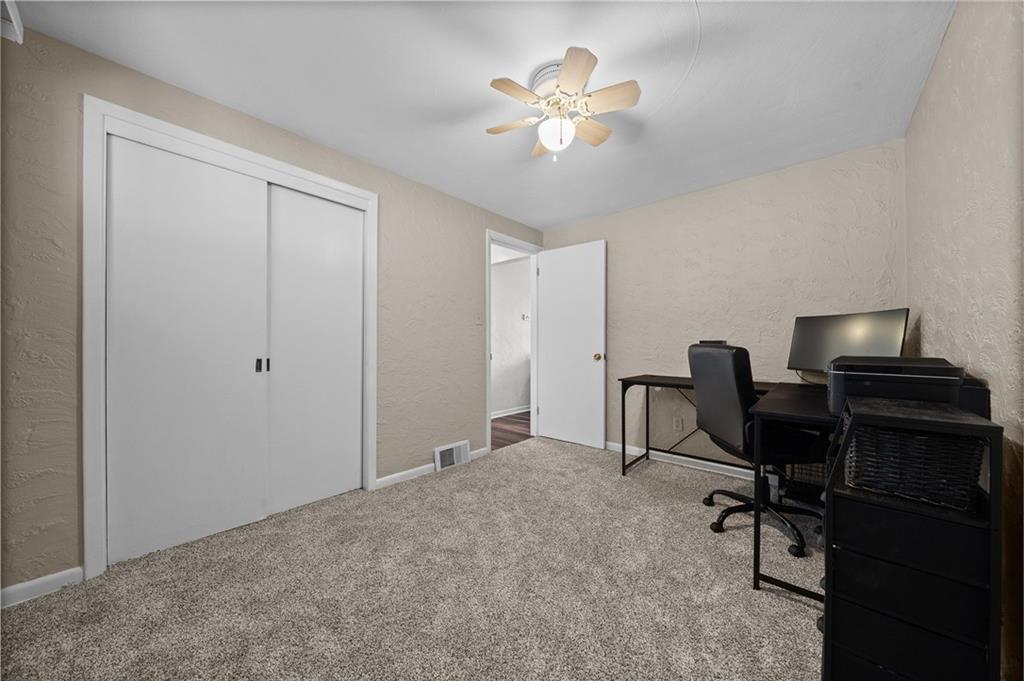 106 Windsor Drive Irwin, PA 15642 - Photo 22 of 30 Third bedroom thoughtfully positioned with access from both the kitchen and hallway, allowing for a flexible layout.