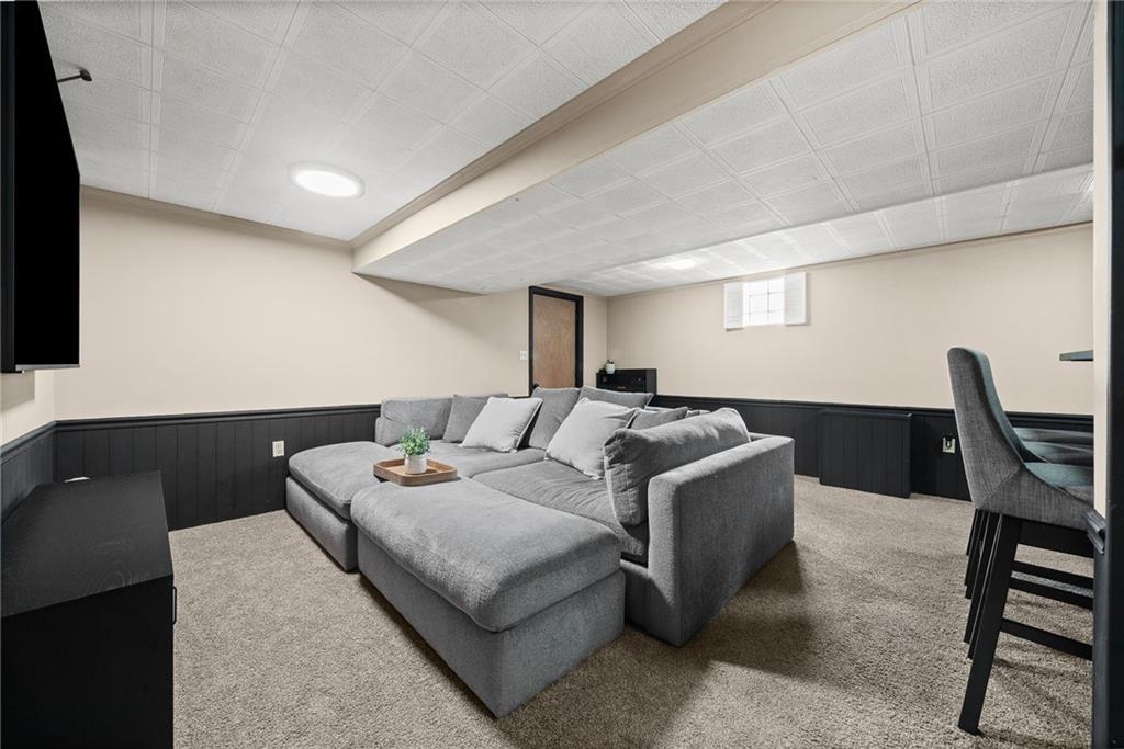 106 Windsor Drive Irwin, PA 15642 - Photo 26 of 30 Ideal lower-level space for entertaining, with a dedicated laundry area thoughtfully set apart.