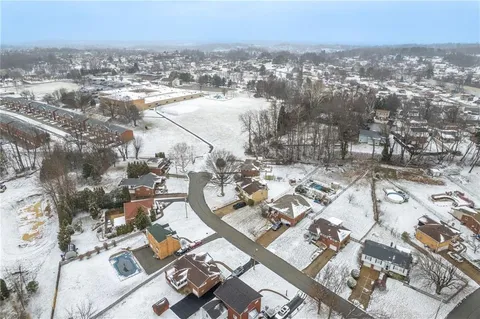 an aerial view of residential house with parking space