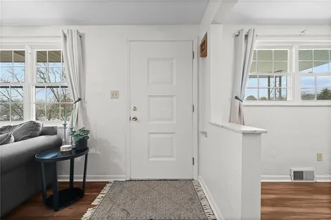 a view of a livingroom with furniture and windows