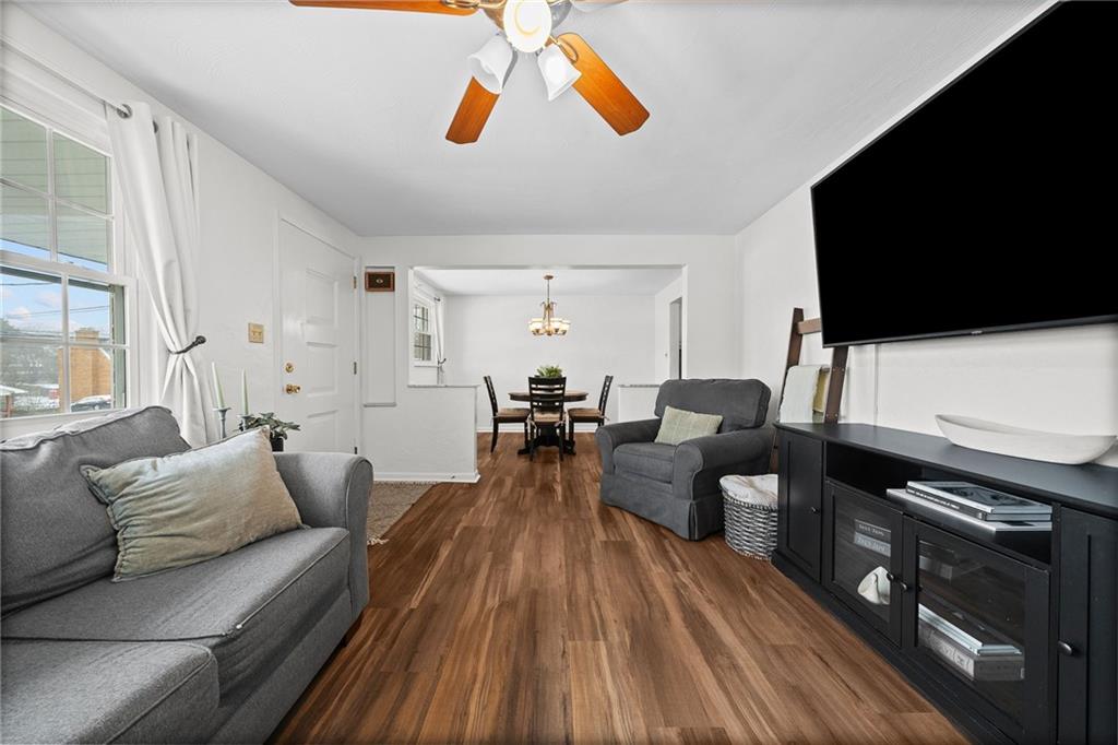 106 Windsor Drive Irwin, PA 15642 - Photo 6 of 30 Updated flooring and a clean, neutral palette create a cohesive look that flows effortlessly through the main living space.