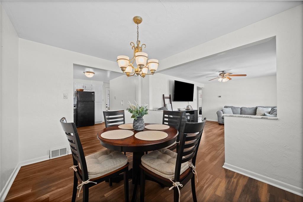 106 Windsor Drive Irwin, PA 15642 - Photo 8 of 30 Formal dining area with comfortable proportions, well-suited for hosting and gathering.