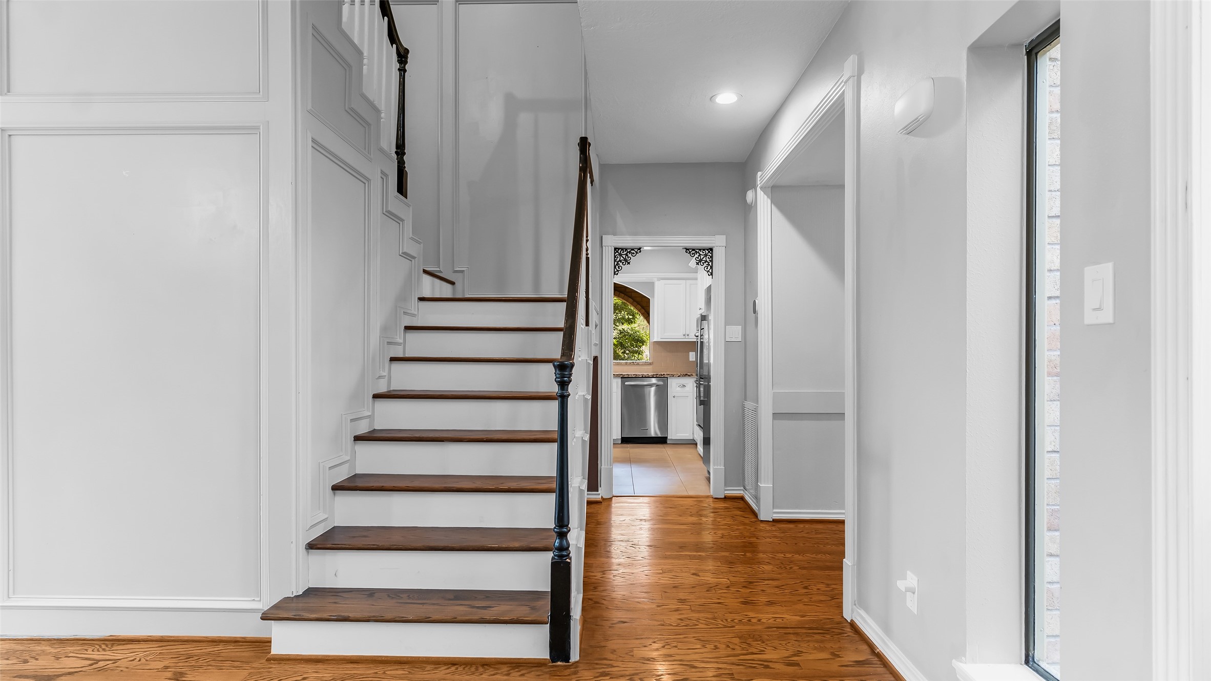 2607 Laurel Ridge Drive Houston, TX 77345 - Photo 27 of 47 a view of entryway with wooden floor and stairs