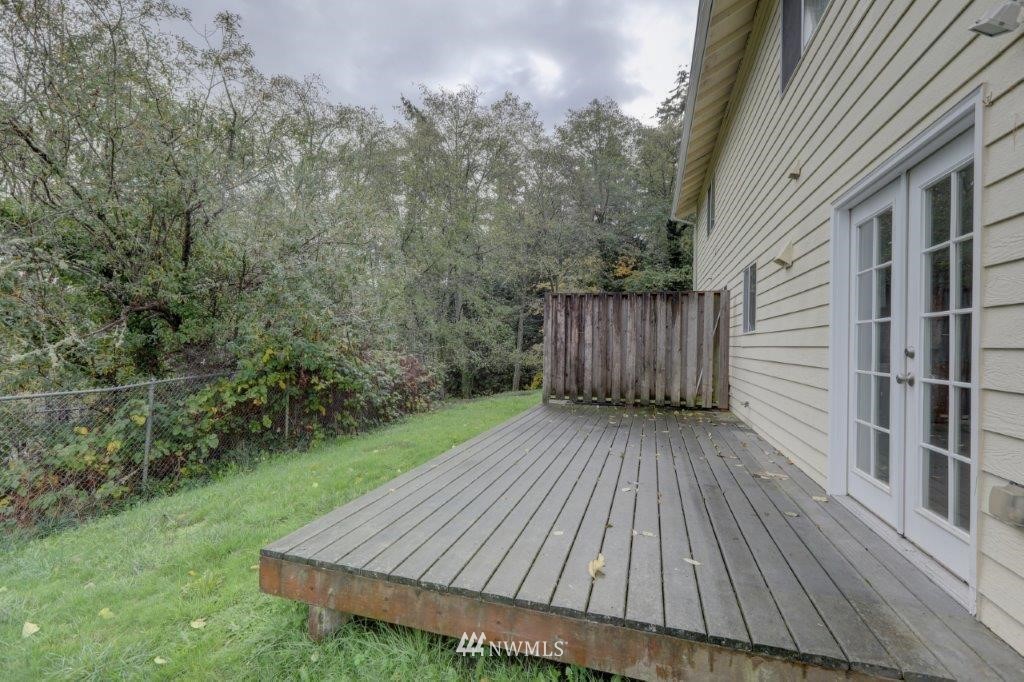 5711 Cady Road Everett, WA 98203 - Photo 3 of 15 a view of wooden deck in front of a house