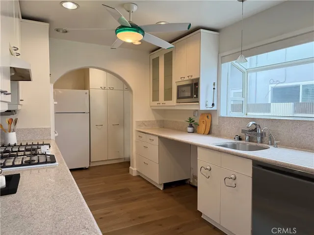 a spacious bathroom with a double vanity sink and a mirror