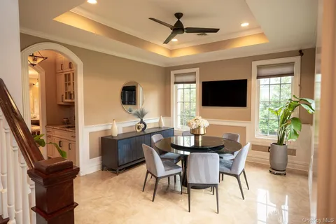 a view of a livingroom with furniture and a flat screen tv