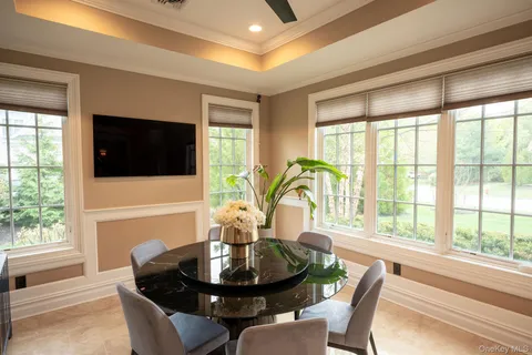 a dining room with furniture and window