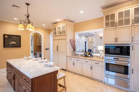 a kitchen with a stove a sink and a refrigerator