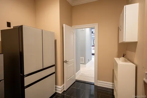 a view of bathroom with a sink mirror and shower
