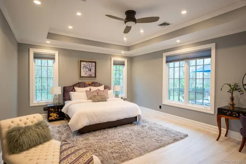 a bedroom with a large bed and a window