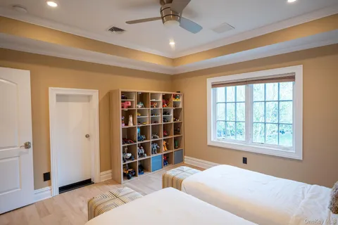 a bedroom with bed and a window