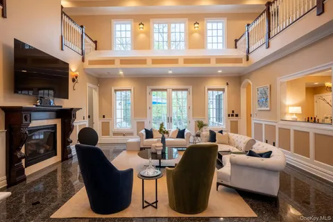 a living room with fireplace furniture and a flat screen tv
