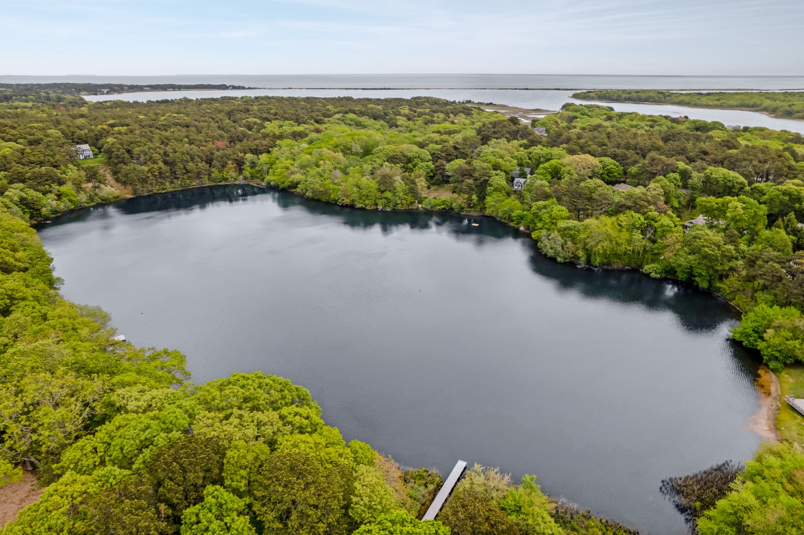 8 Fresh Pond Road Oak Bluffs, MA 02557 - Photo 35 of 36 a view of a lake with a mountain in the background