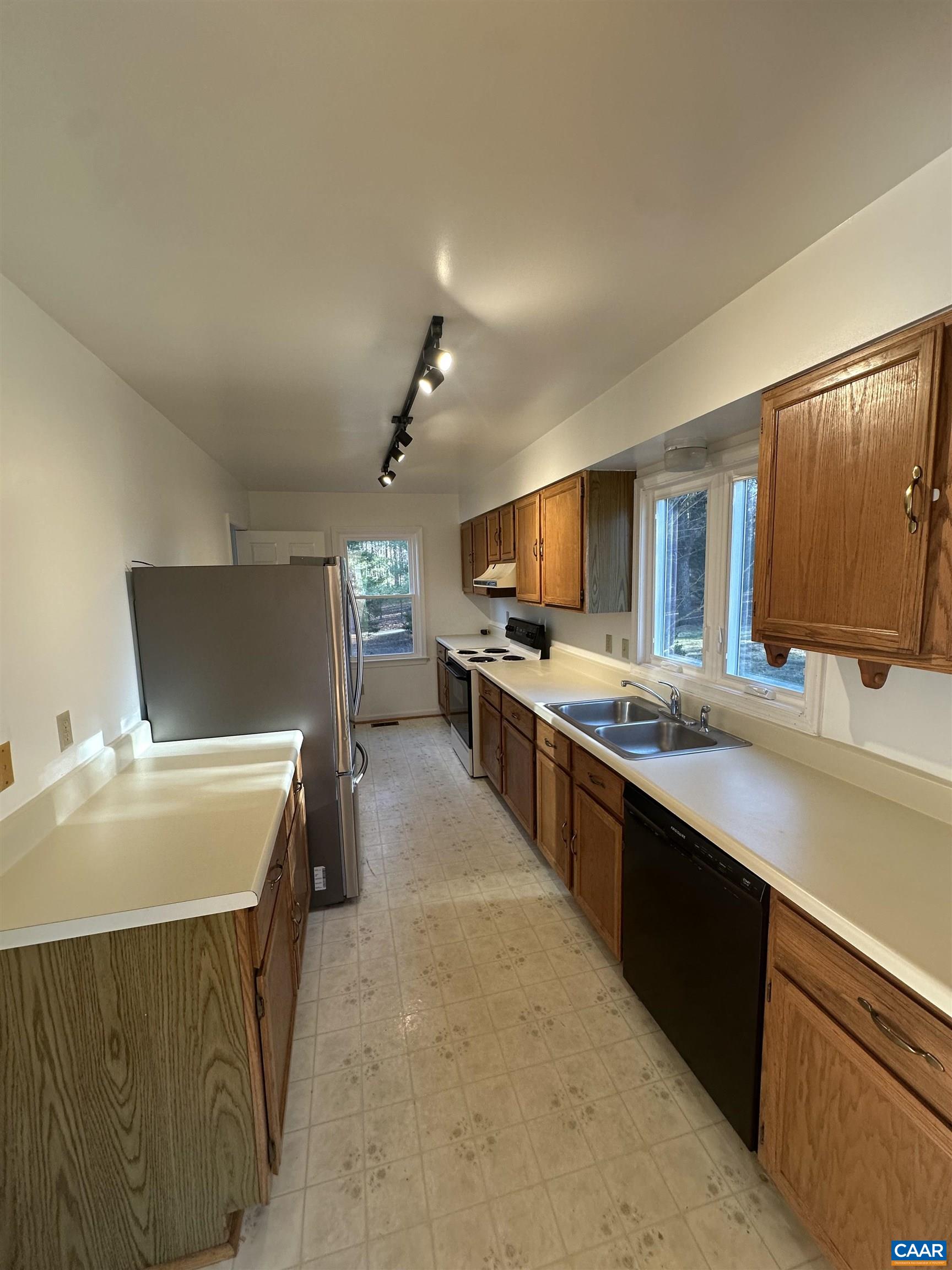 Foxfield Track Charlottesville, VA 22901 - Photo 12 of 26 a large kitchen with kitchen island a sink stove and refrigerator