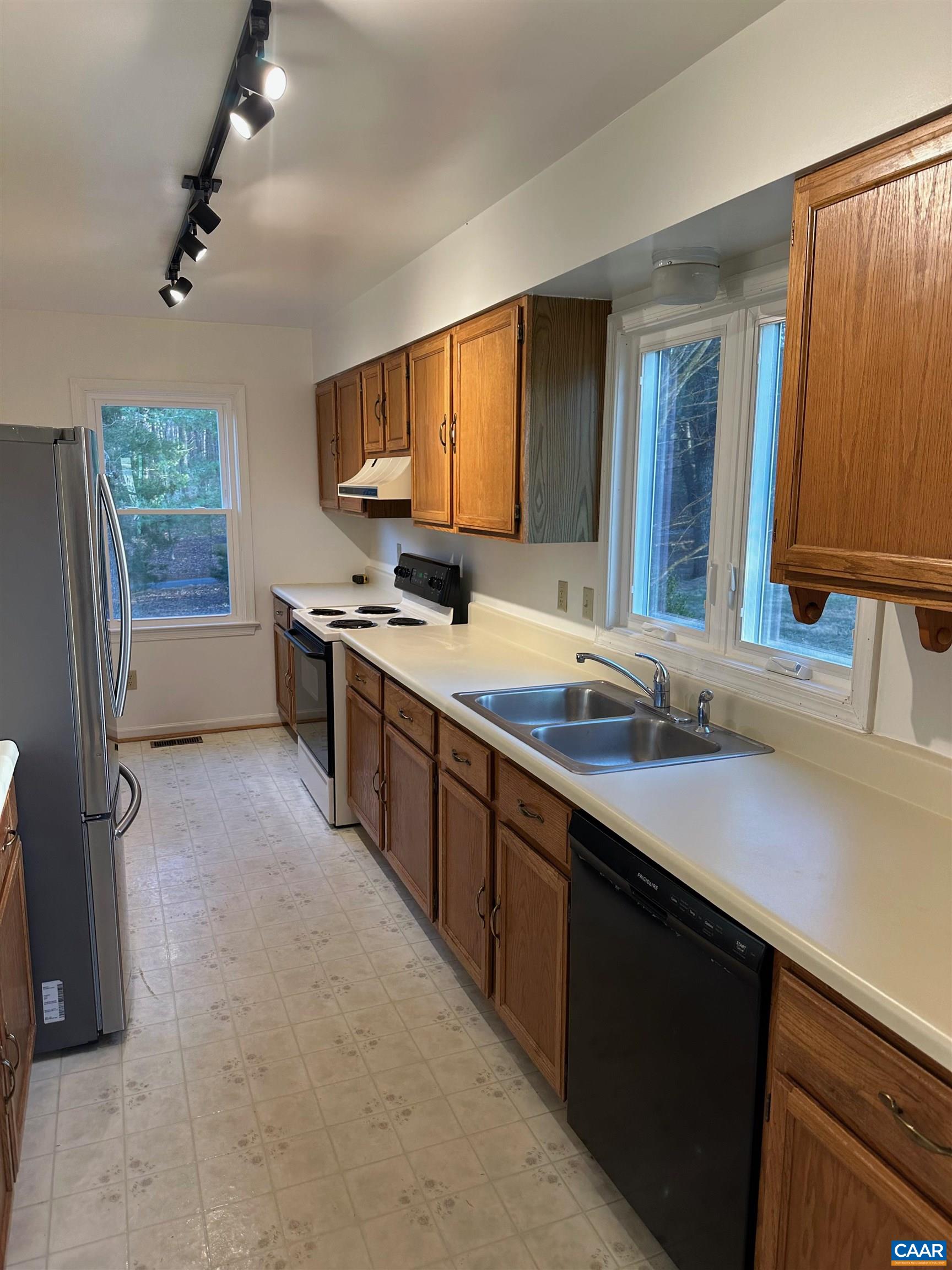 Foxfield Track Charlottesville, VA 22901 - Photo 13 of 26 a kitchen with a sink stove and cabinets