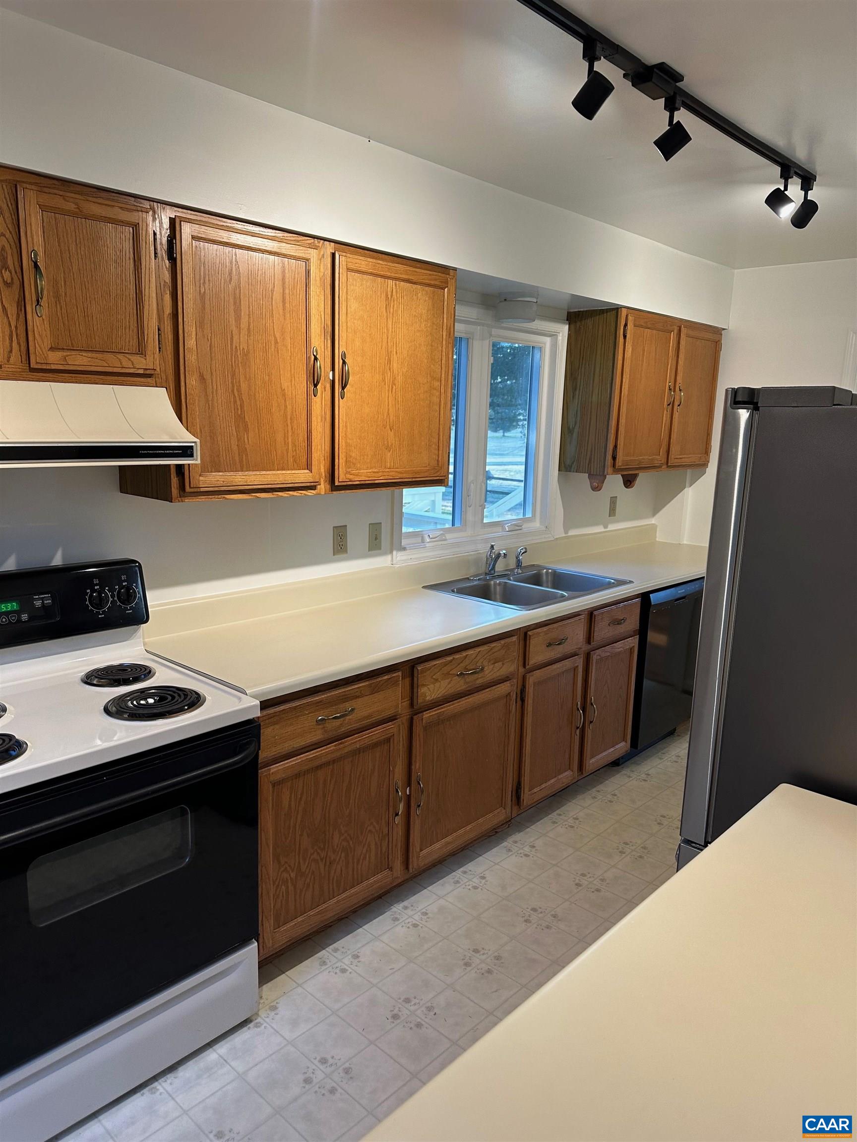 Foxfield Track Charlottesville, VA 22901 - Photo 14 of 26 a kitchen with a sink stove and refrigerator