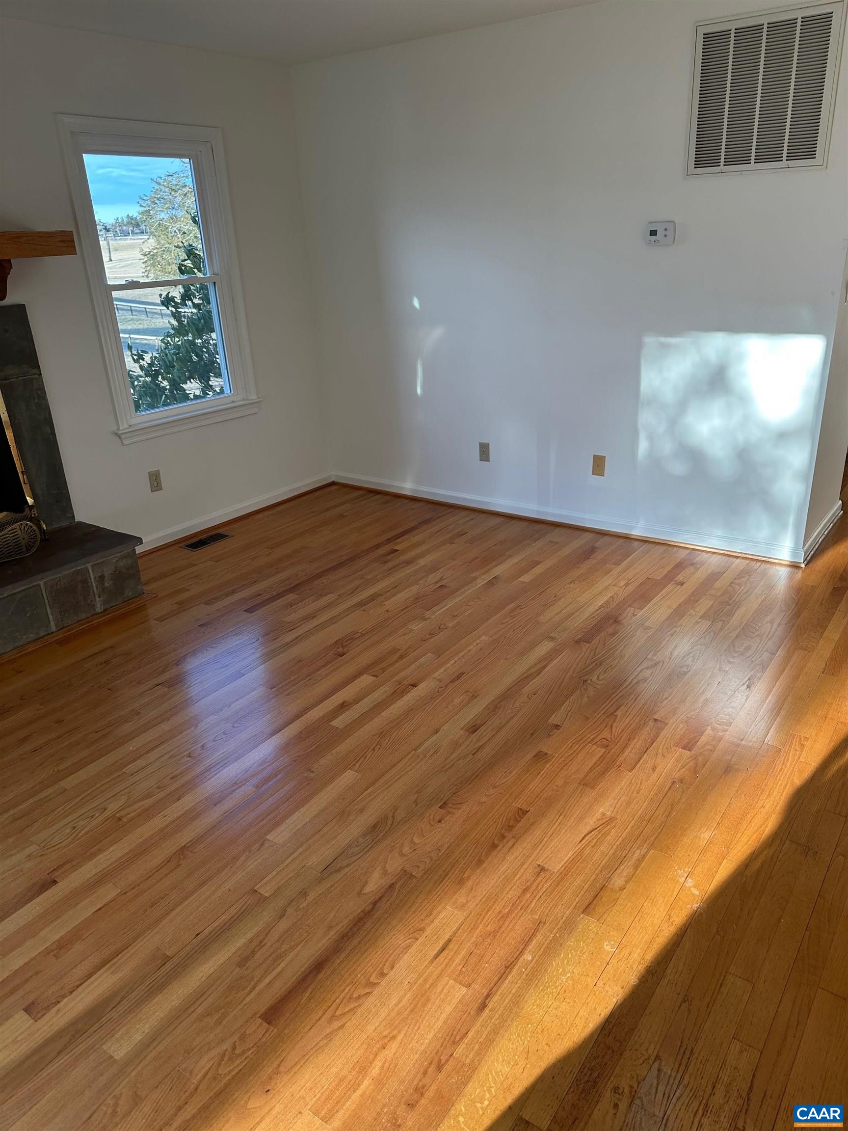 Foxfield Track Charlottesville, VA 22901 - Photo 15 of 26 an empty room with wooden floor and windows