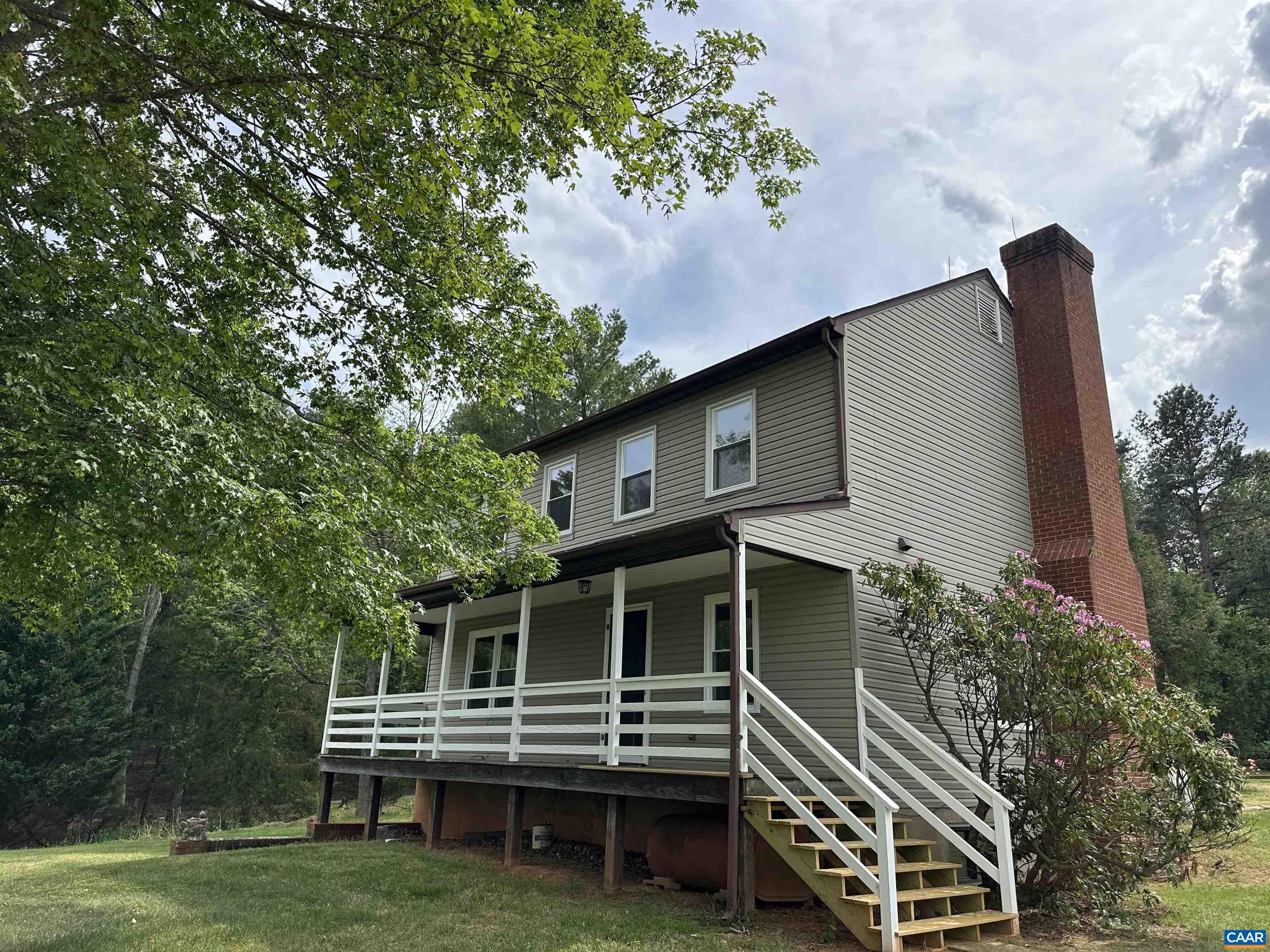 Foxfield Track Charlottesville, VA 22901 - Photo 2 of 26 a front view of a house with a garden