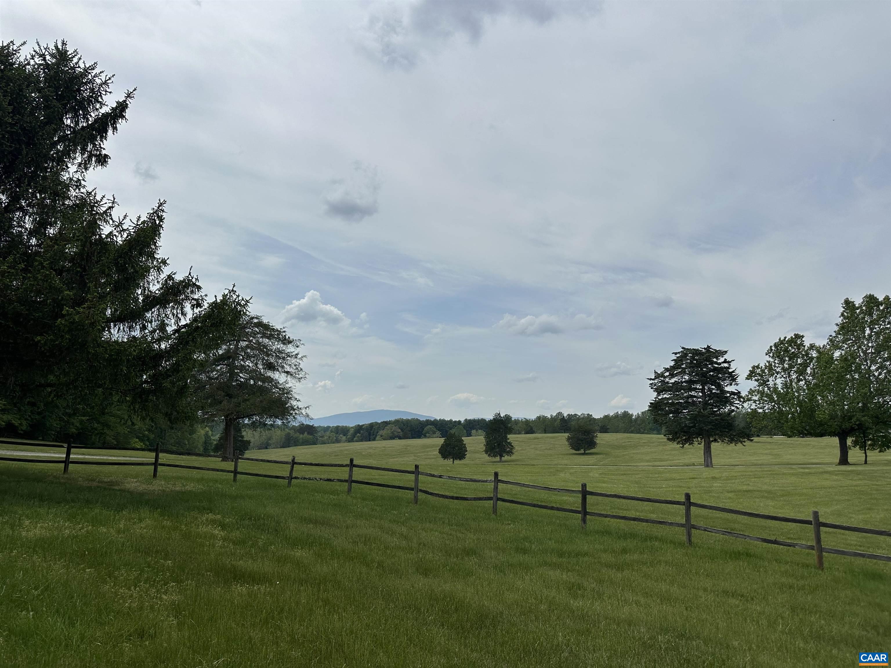 Foxfield Track Charlottesville, VA 22901 - Photo 6 of 26 a view of a golf course with a lake