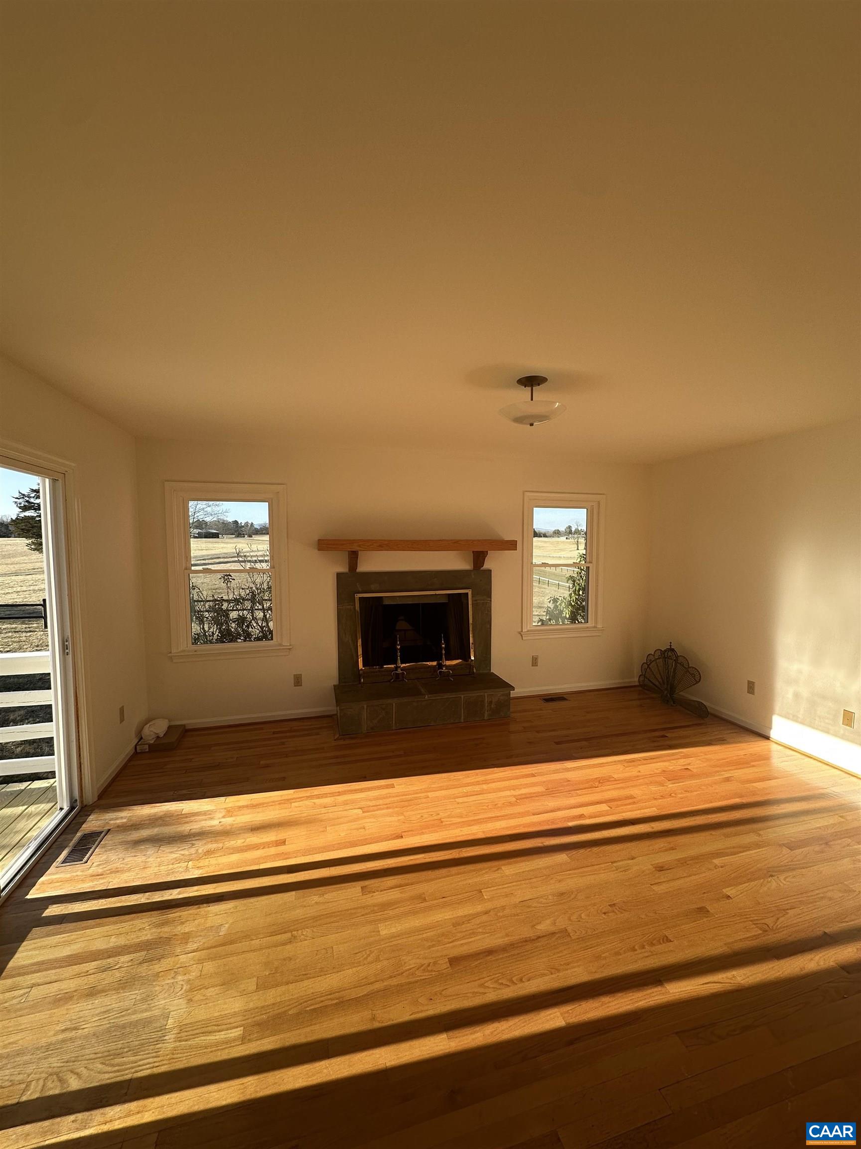 Foxfield Track Charlottesville, VA 22901 - Photo 9 of 26 a view of empty room with fireplace and fan