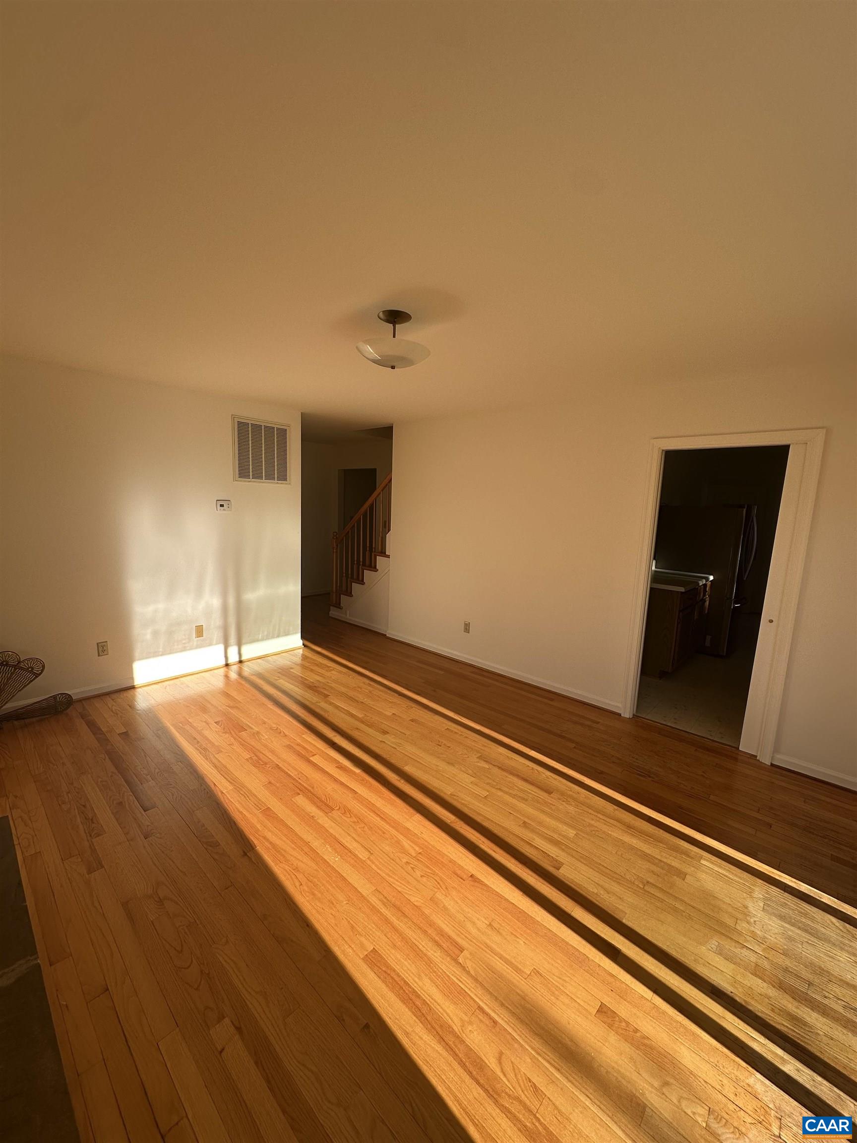Foxfield Track Charlottesville, VA 22901 - Photo 10 of 26 a view of a livingroom with wooden floor and an empty space