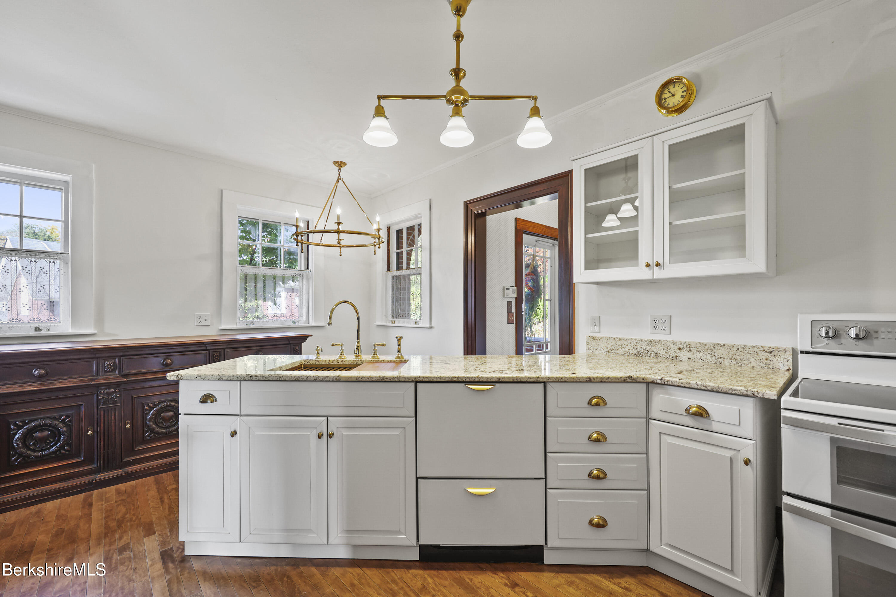 5 Crofut Street Pittsfield, MA 01201 - Photo 13 of 63 a kitchen with cabinets stainless steel appliances and a chandelier