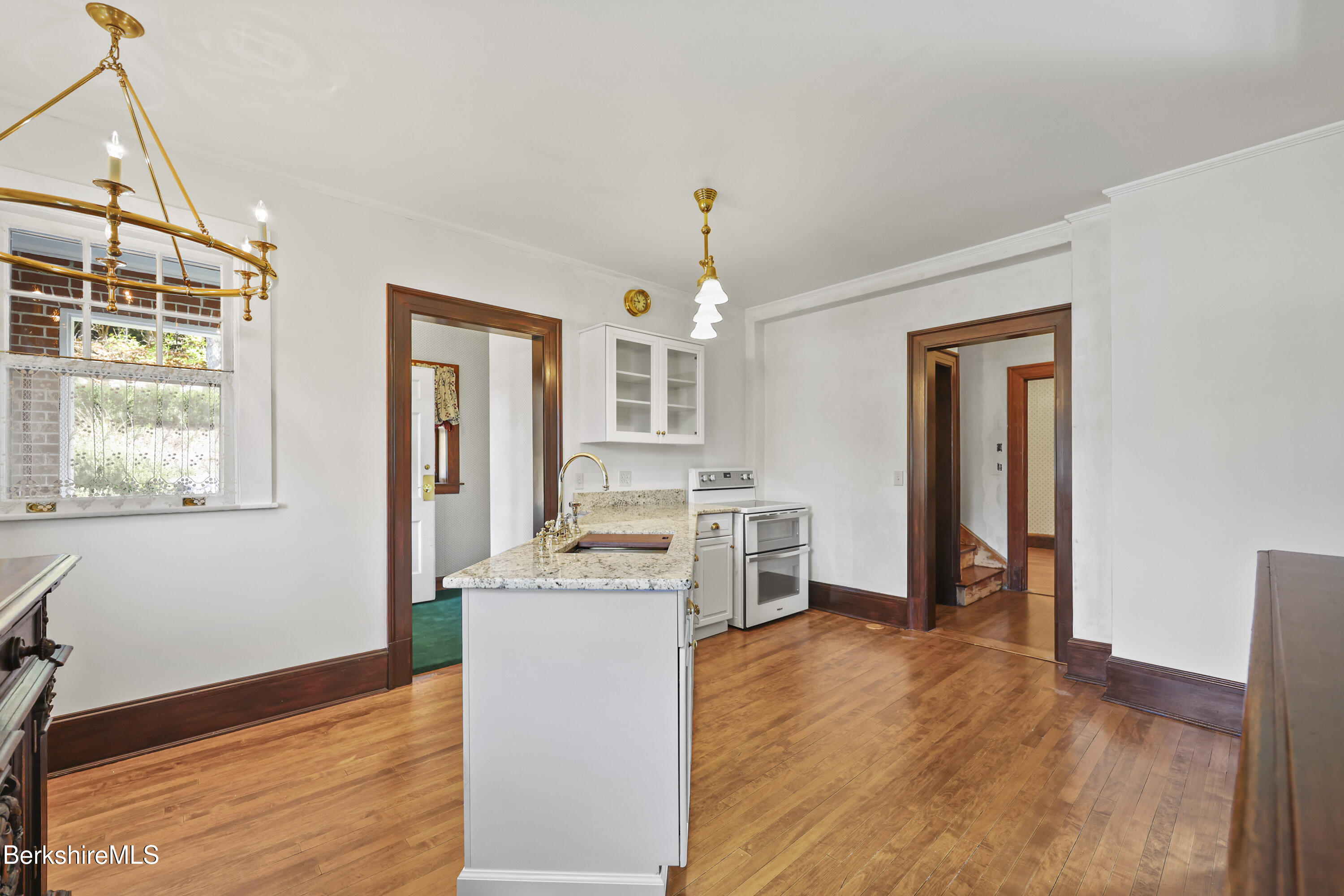 5 Crofut Street Pittsfield, MA 01201 - Photo 15 of 63 a view of a kitchen with a sink dishwasher and fireplace