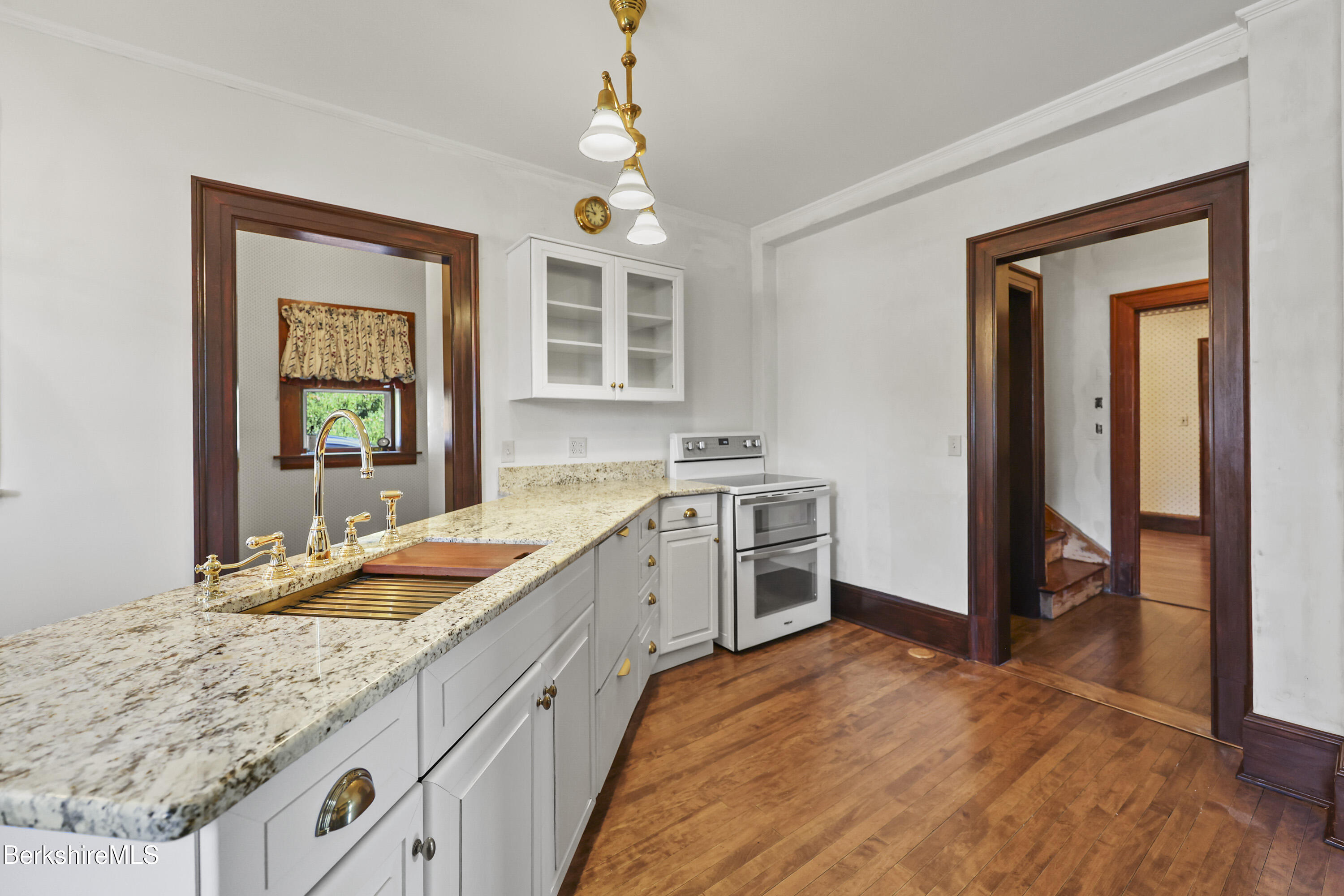5 Crofut Street Pittsfield, MA 01201 - Photo 16 of 63 a spacious bathroom with a granite countertop sink and a mirror