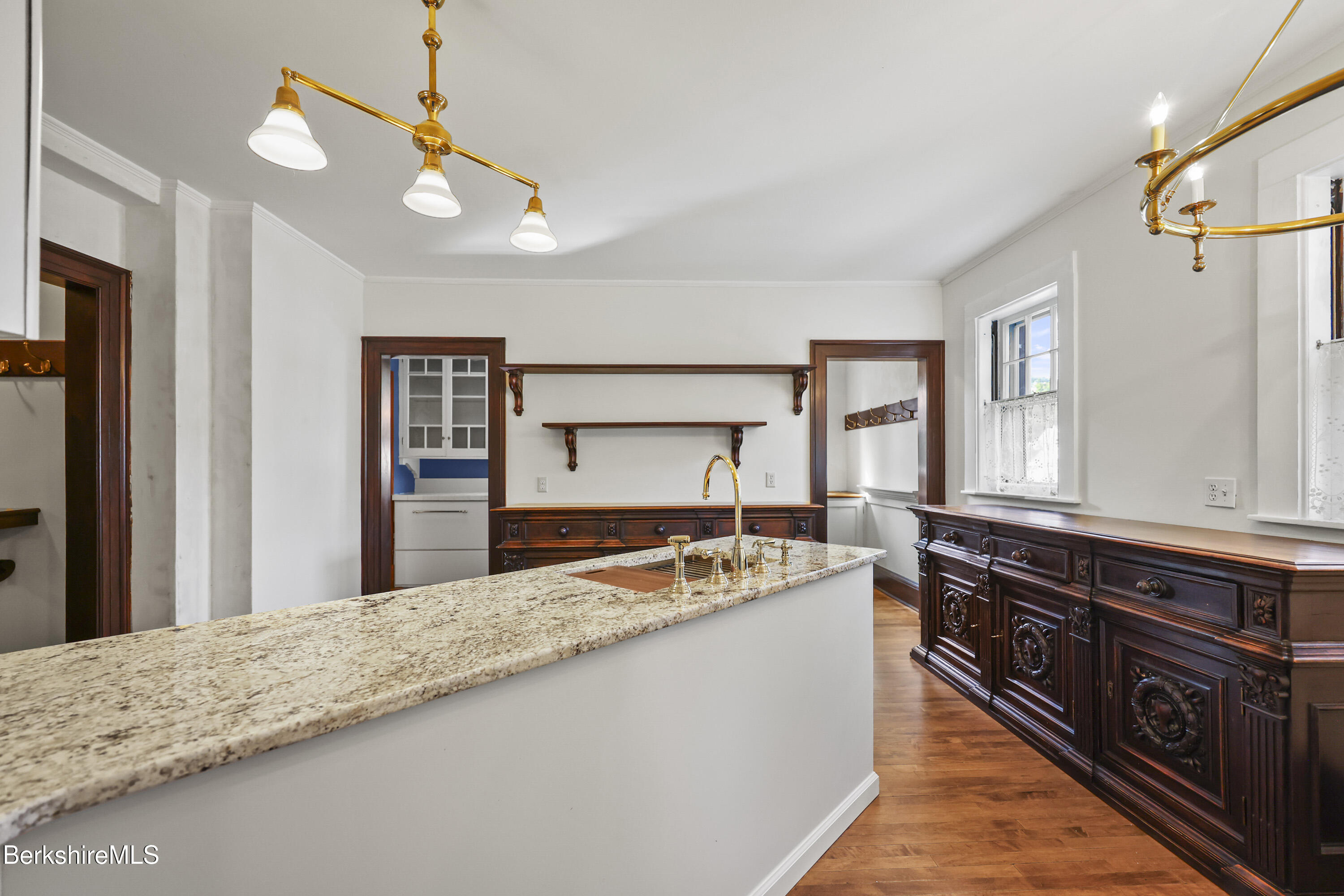 5 Crofut Street Pittsfield, MA 01201 - Photo 17 of 63 a kitchen with stainless steel appliances granite countertop a stove a sink and a refrigerator